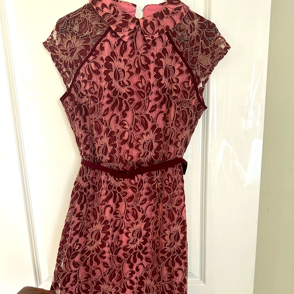 Wine colored Eva Mendes dress with a belt to add a more polished finish.